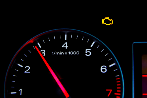 What your engine light is trying to tell you CAMS Automotive Kenner La, Close up view of a speedometer with check engine light lit up yellow