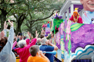 Mardi Gras Tips for Revelers of all Ages from your friends at CAMS Automotive in Kenner, La. Image of Mardi Gras float going down road in New Orleans during parade with revelers of all ages extending out their hands in hopes to catch the beads that are being thrown from the float