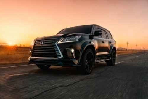Expert Lexus repair and maintenance services in Kenner, LA. at CAMS Automotive. Image of newer model black Lexus SUV driving on Florida highway.